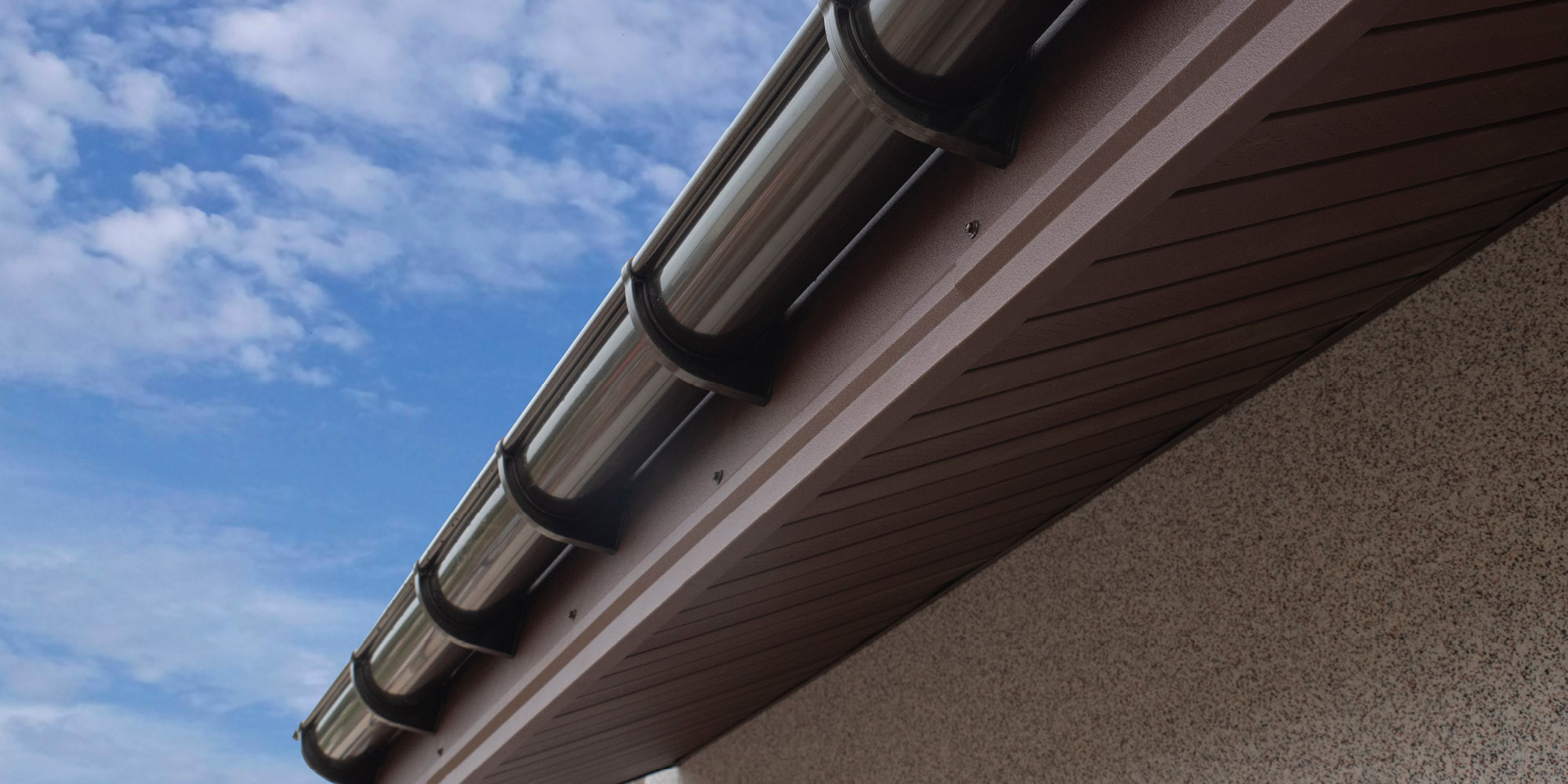 Coloring of PVC roof guttering. Not just a question of cost.