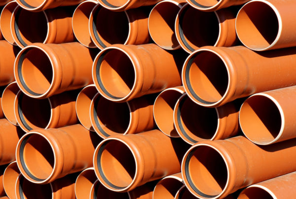 stacked earth tubes in orange-brown