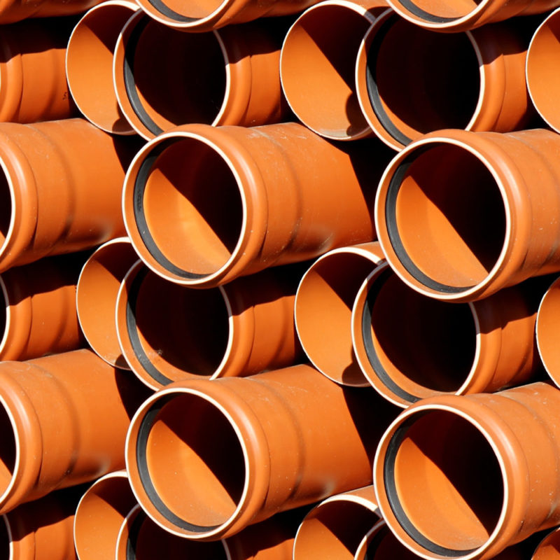 stacked earth tubes in orange-brown
