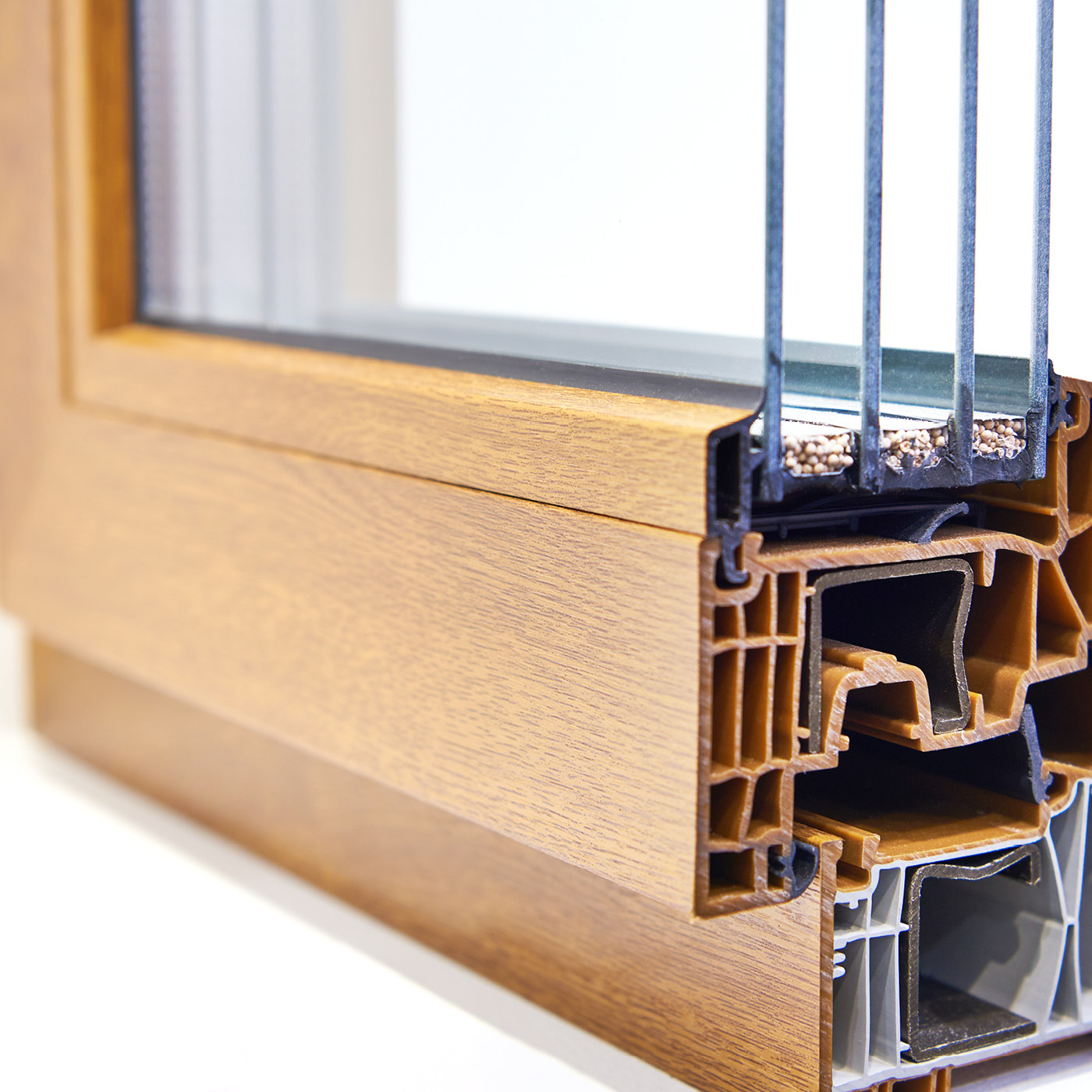 brown window profile in cross section colored with fine granules